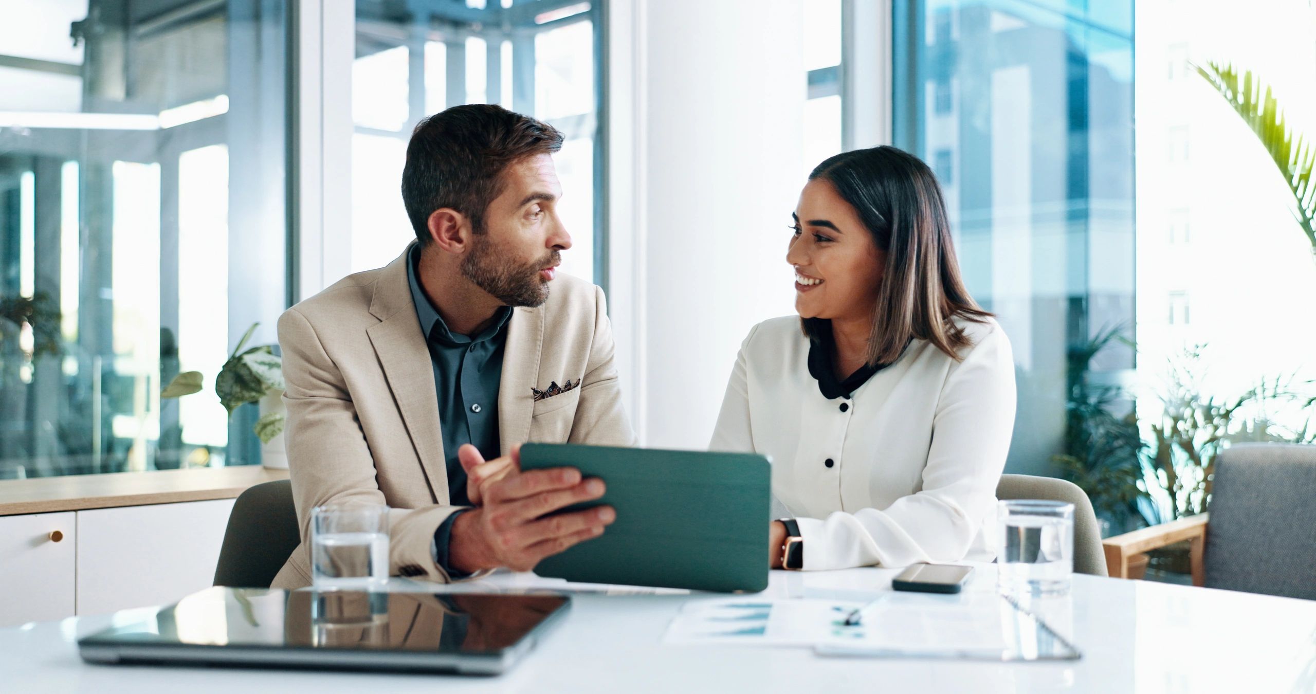 A man and woman are sitting at a table